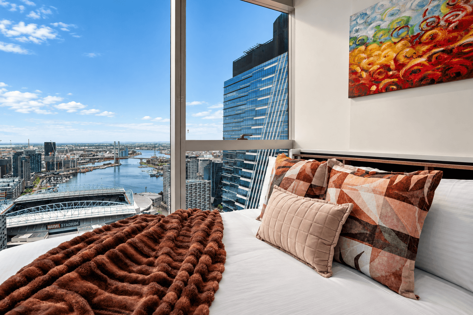 Second bedroom framing direct views of Marvel Stadium and Victoria Harbour