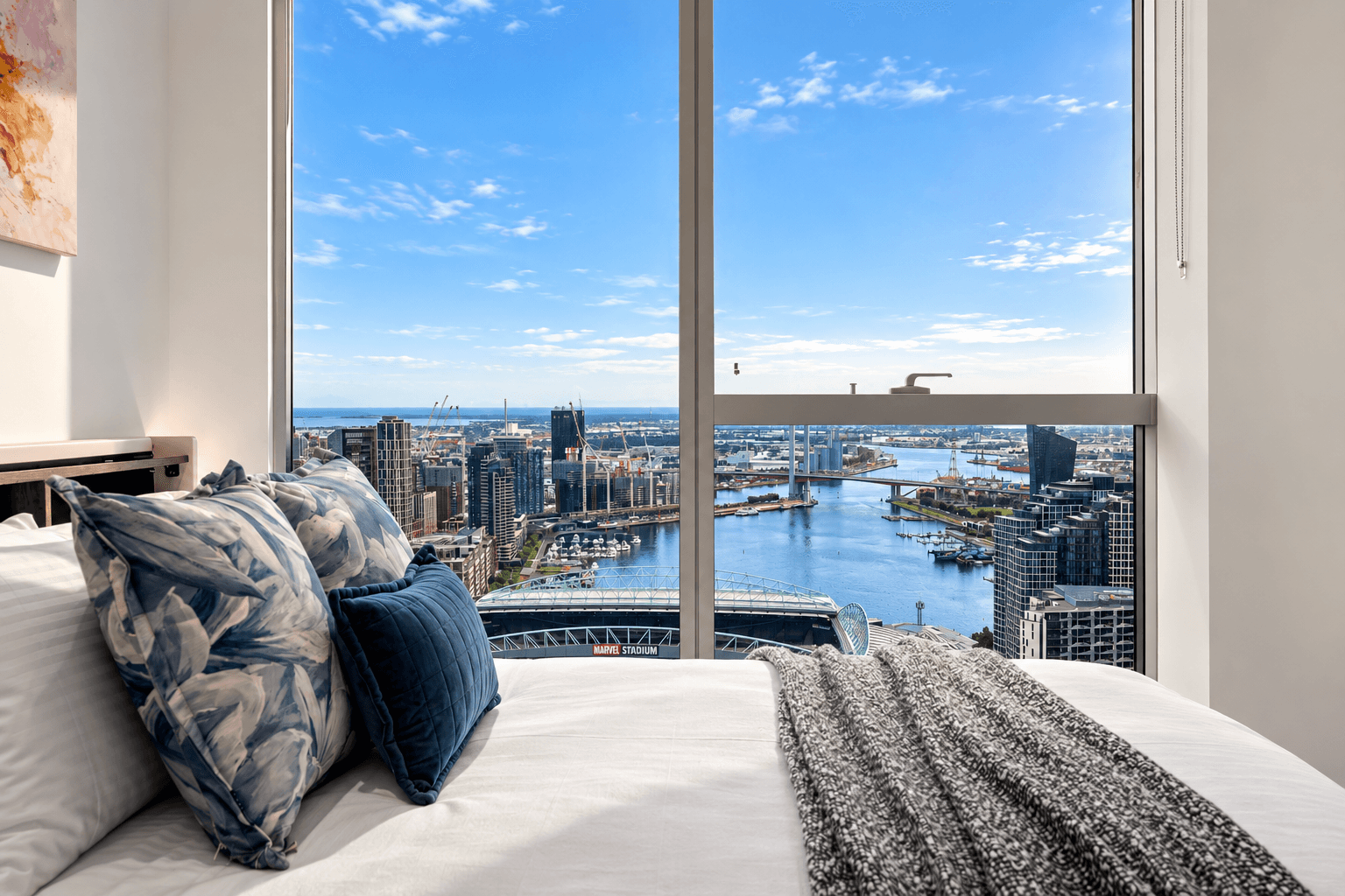 Third bedroom with expansive views over Docklands, Bolte Bridge, and the bay