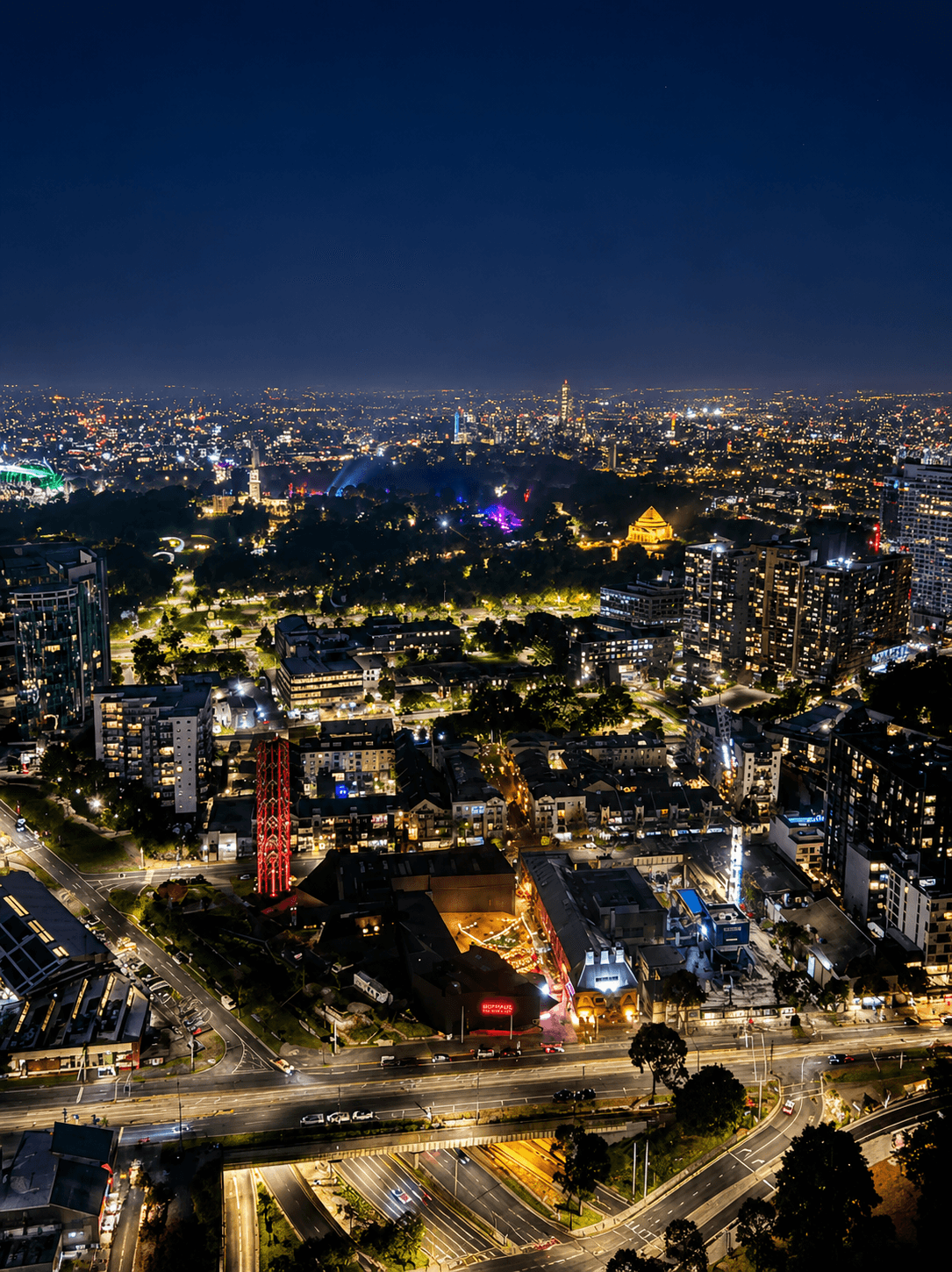 Breathtaking night view of illuminated Melbourne city lights, St Kilda Road, and parklands from Level 51