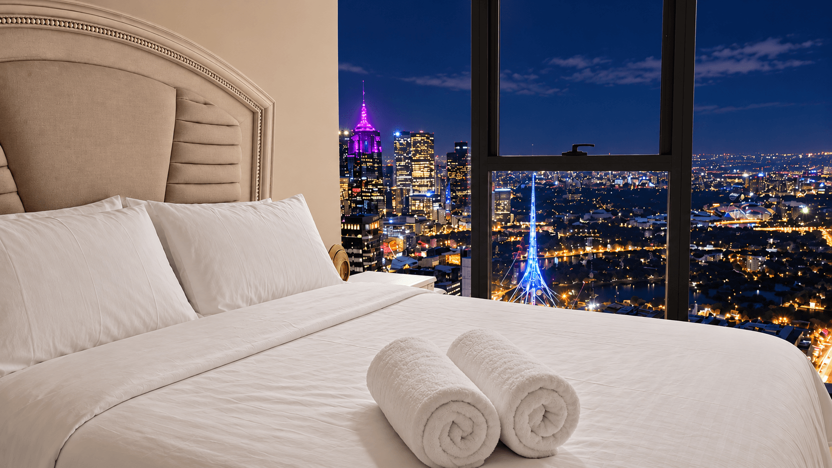 Panoramic night skyline views from Level 51 master bedroom
